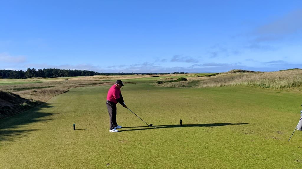 Golfer on a scenic course fairway